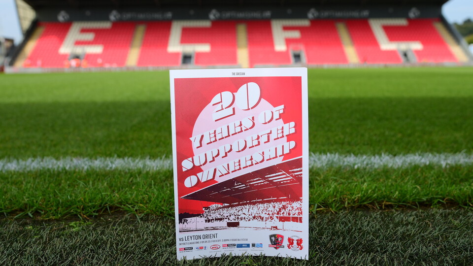 Image of an ECFC programme on the stadium pitch